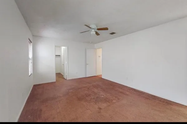 a view of a big room with carpet