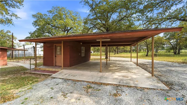 a backyard of a house with a outdoor seating