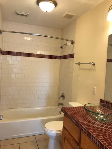 a bathroom with a shower and a bathtub