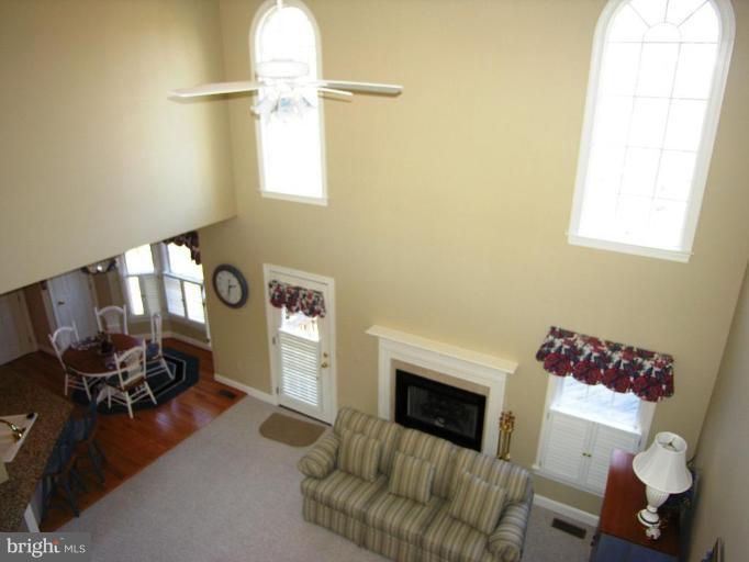 7816 Pohick Road Springfield, VA 22153 - Photo 11 of 30 a living room with furniture and a fireplace