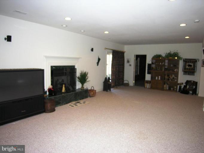 7816 Pohick Road Springfield, VA 22153 - Photo 12 of 30 a view of a livingroom with furniture and a flat screen tv