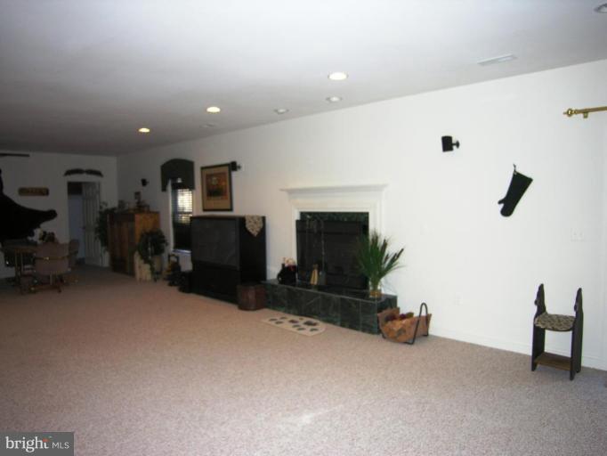 7816 Pohick Road Springfield, VA 22153 - Photo 15 of 30 a living room with furniture and a flat screen tv