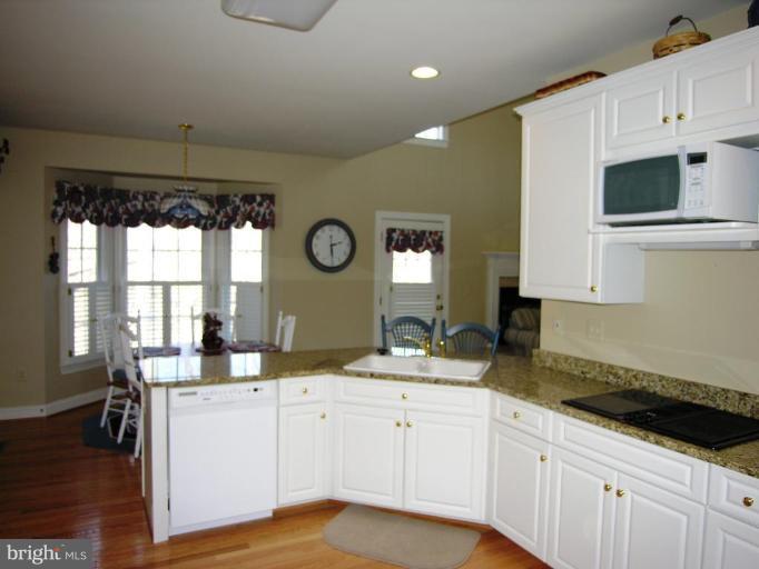 7816 Pohick Road Springfield, VA 22153 - Photo 20 of 30 a kitchen with a sink cabinets and window