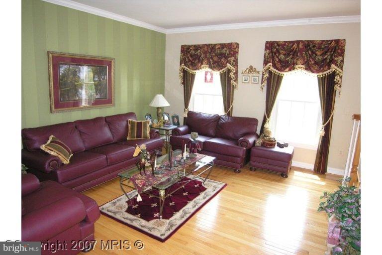 7816 Pohick Road Springfield, VA 22153 - Photo 3 of 30 a living room with furniture and a rug