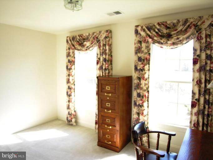 7816 Pohick Road Springfield, VA 22153 - Photo 25 of 30 a view of walk in closet with clothes and shoes