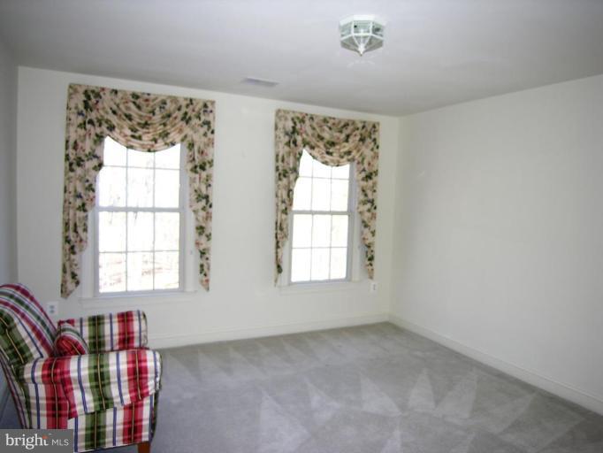 7816 Pohick Road Springfield, VA 22153 - Photo 26 of 30 a living room with furniture and a window