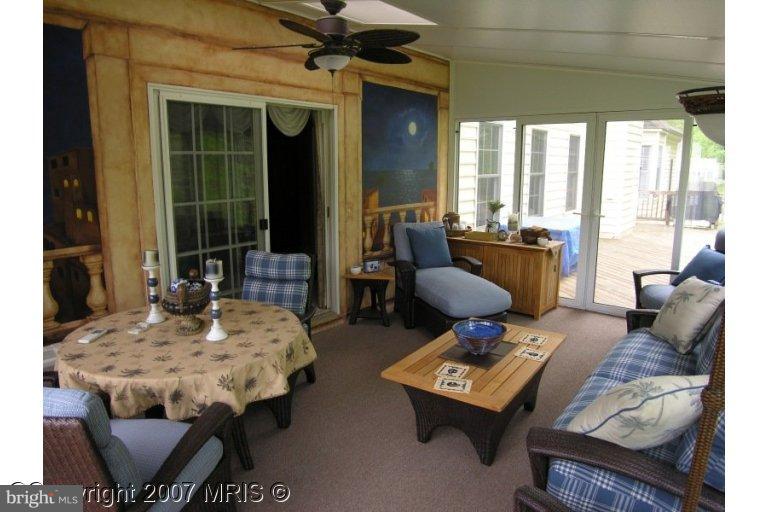 7816 Pohick Road Springfield, VA 22153 - Photo 8 of 30 a living room with furniture and a table