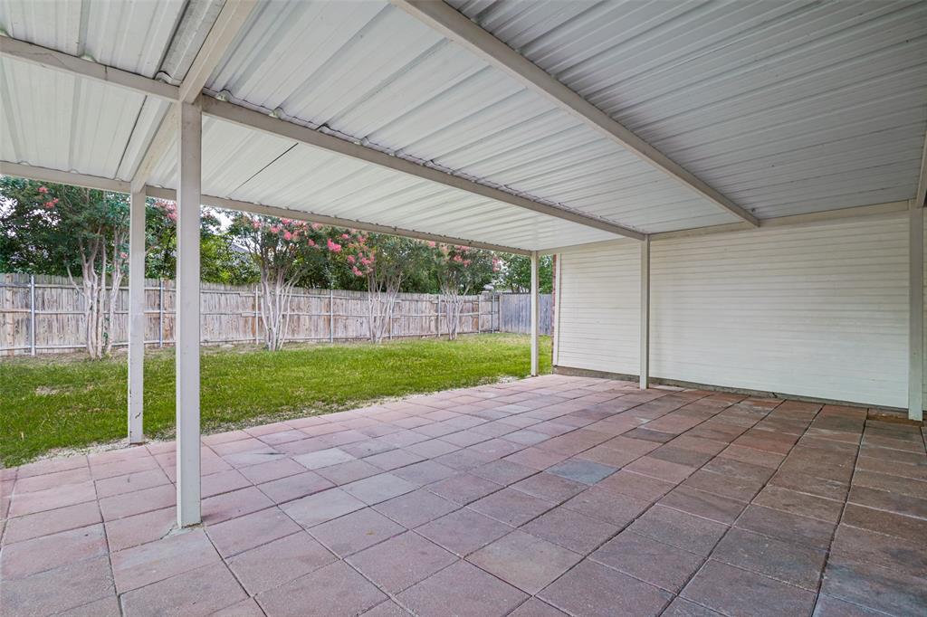 3111 Creekside Drive Sachse, TX 75048 - Photo 21 of 25 Covered patio featuring a corrugated metal roof, support columns, and paver flooring