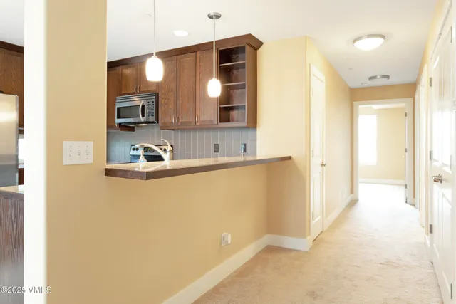 a bathroom with a sink a mirror and a shower
