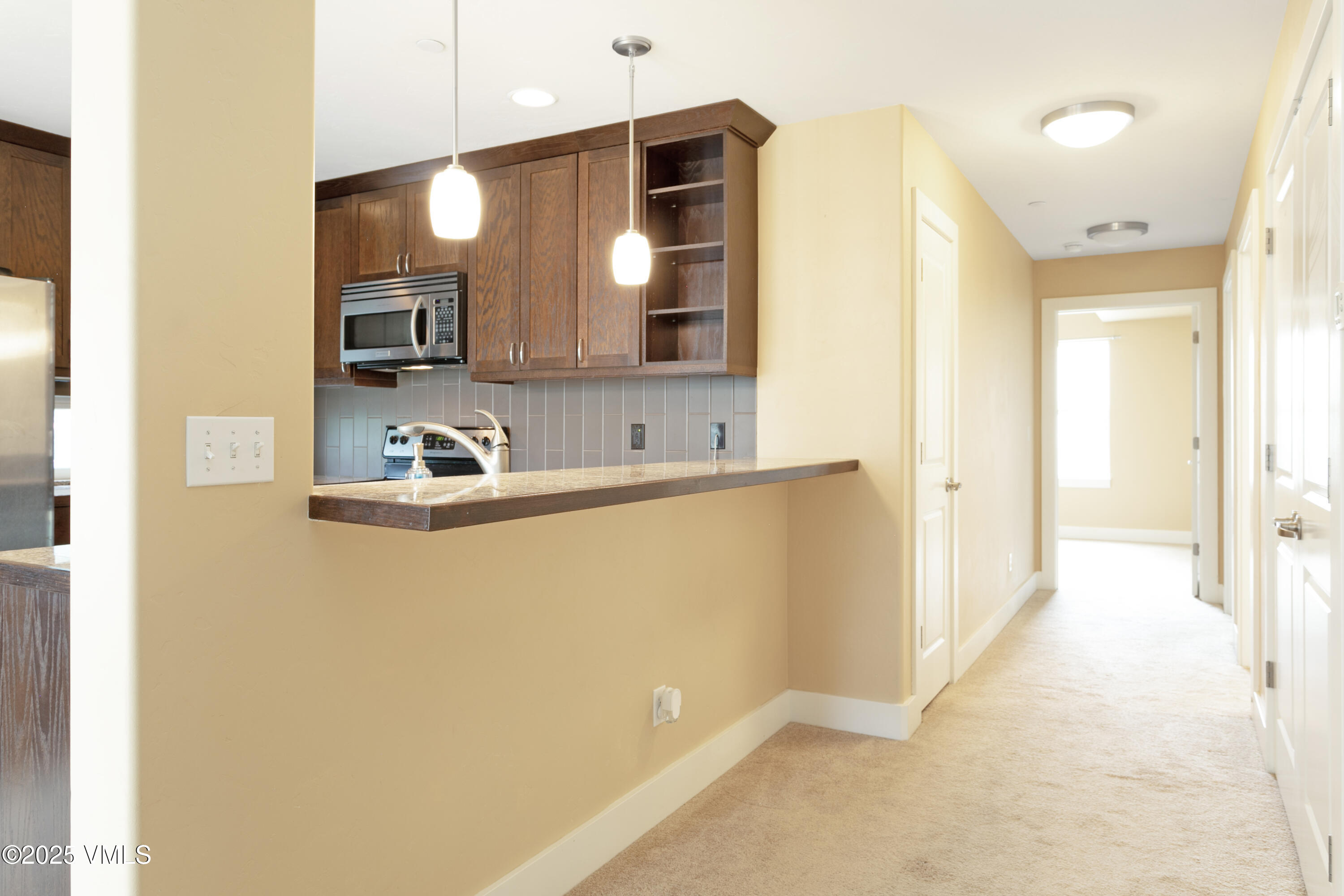 80 Freestone Road, Unit B201 Eagle, CO 81631 - Photo 11 of 24 a bathroom with a sink a mirror and a shower