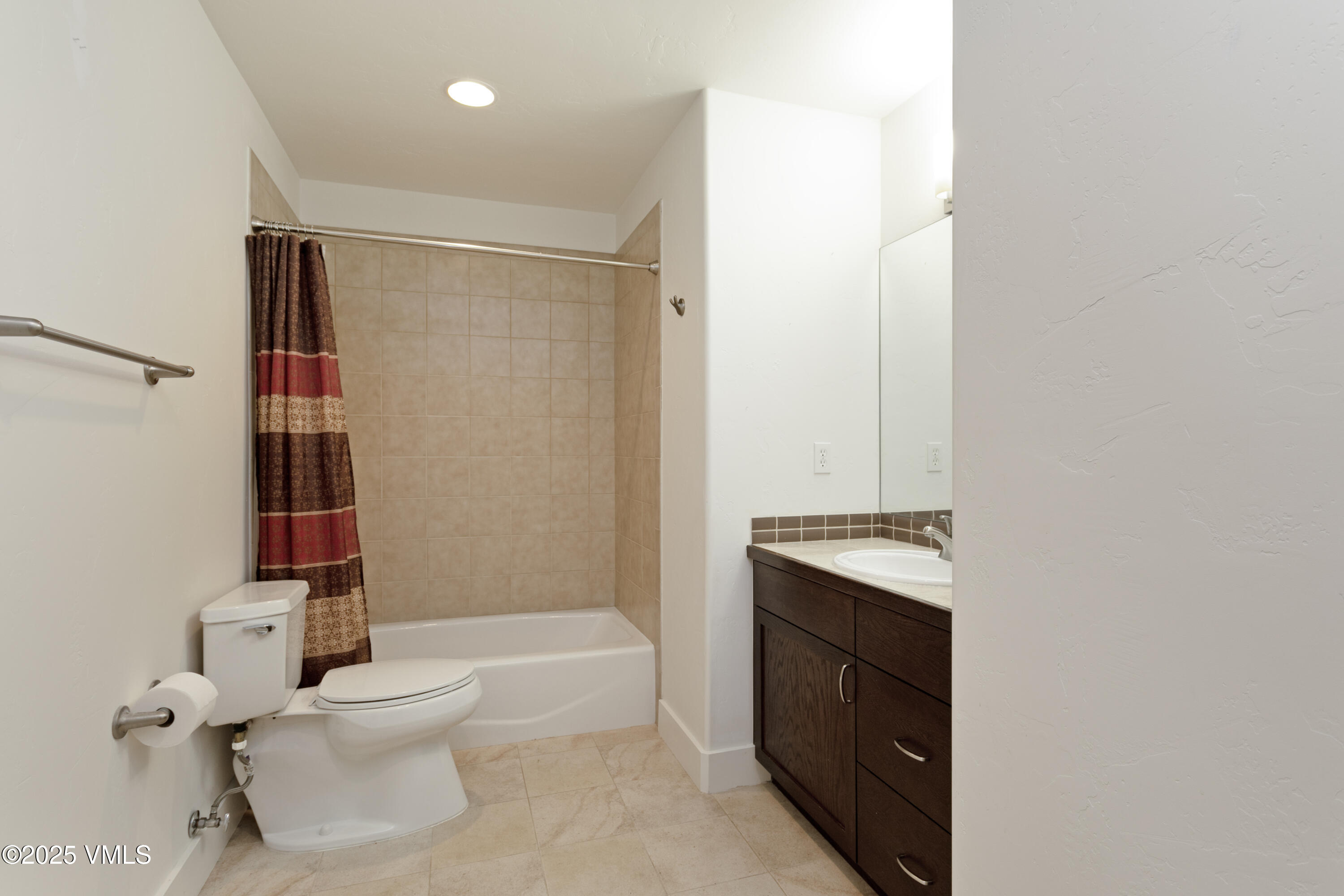 80 Freestone Road, Unit B201 Eagle, CO 81631 - Photo 13 of 24 a bathroom with a sink toilet and shower