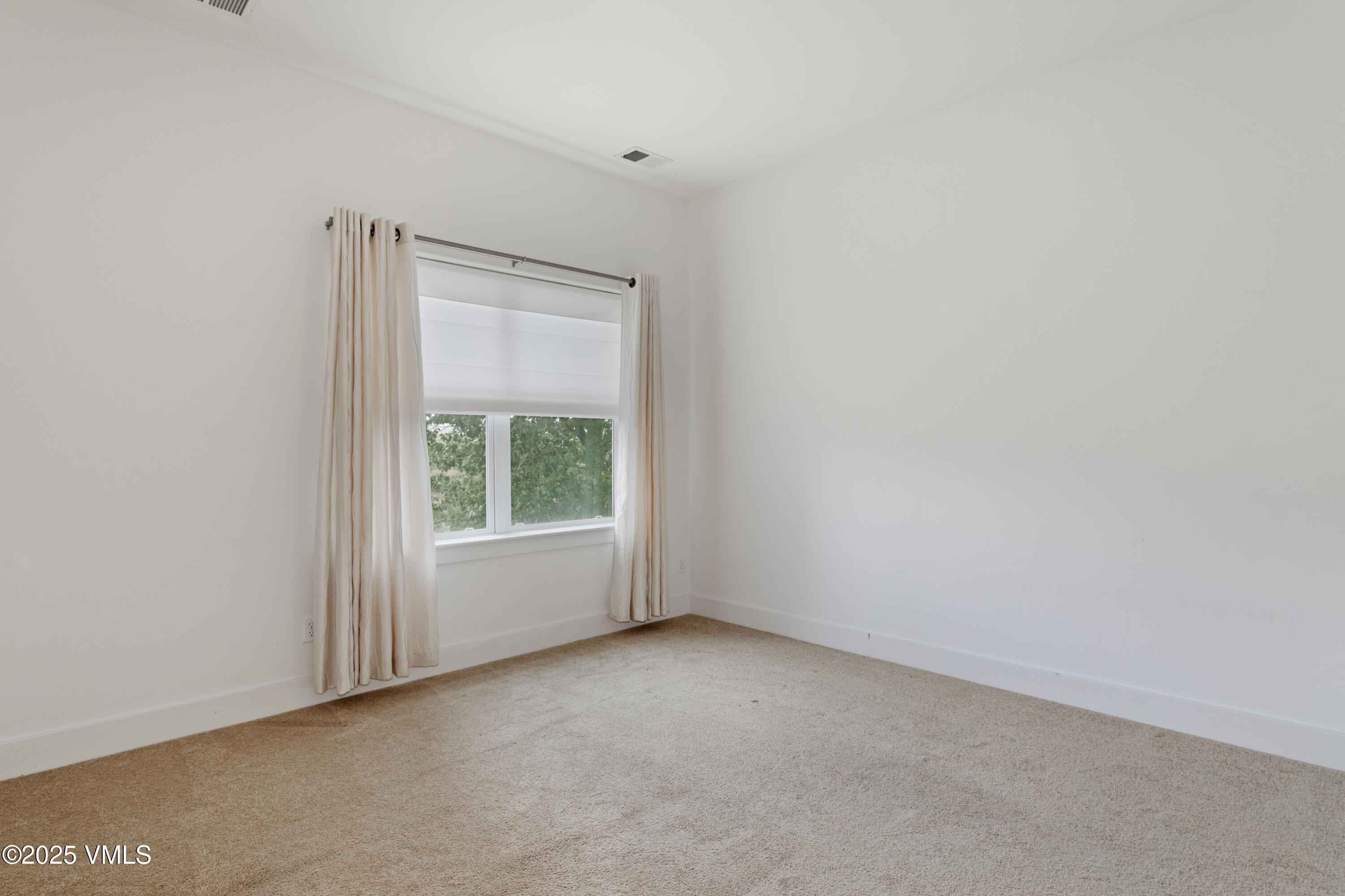 80 Freestone Road, Unit B201 Eagle, CO 81631 - Photo 15 of 24 a view of an empty room with a window