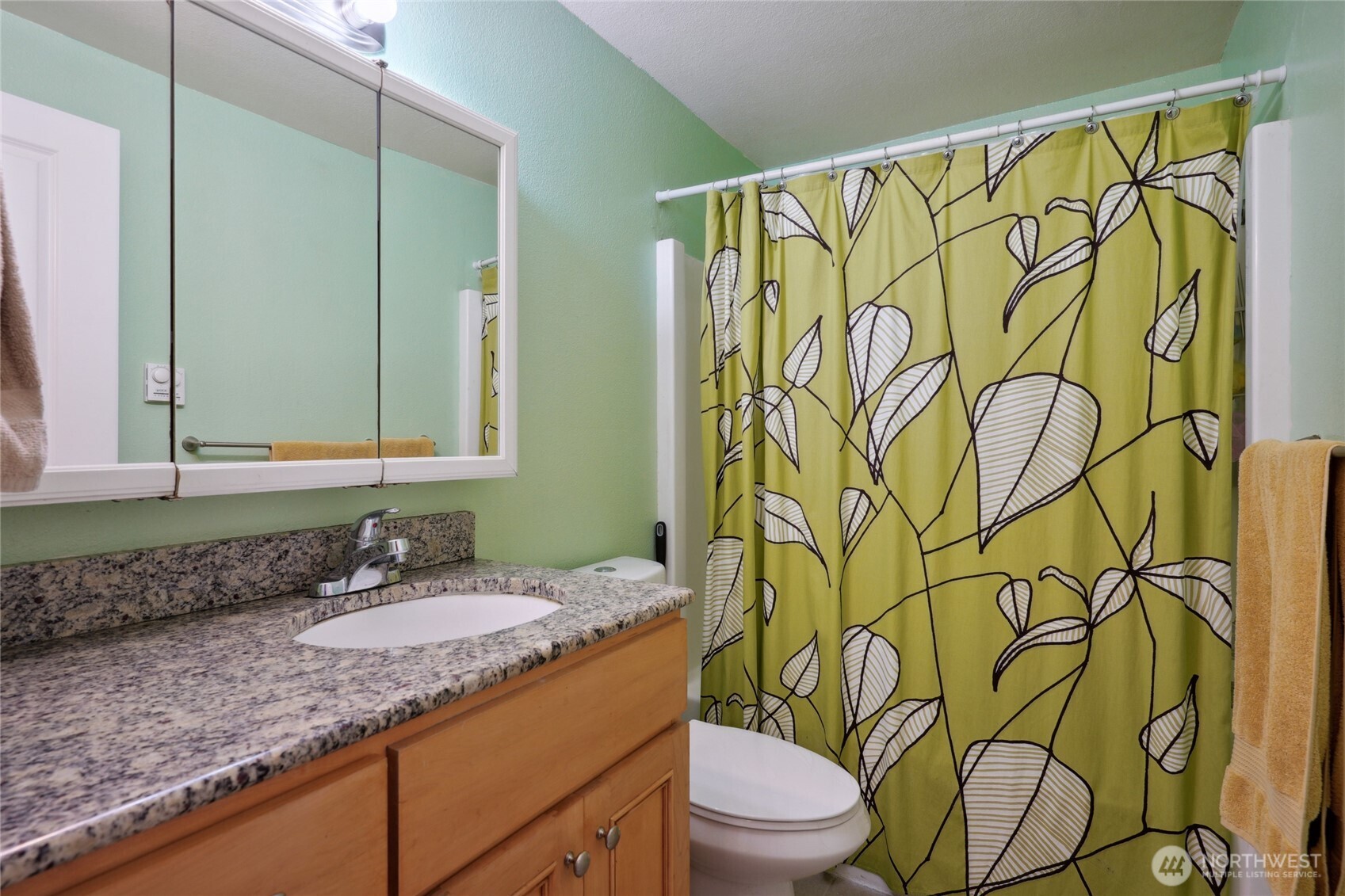 1450 Alameda Avenue, Unit 1 Fircrest, WA 98466 - Photo 15 of 19 a bathroom with a granite countertop sink and a mirror
