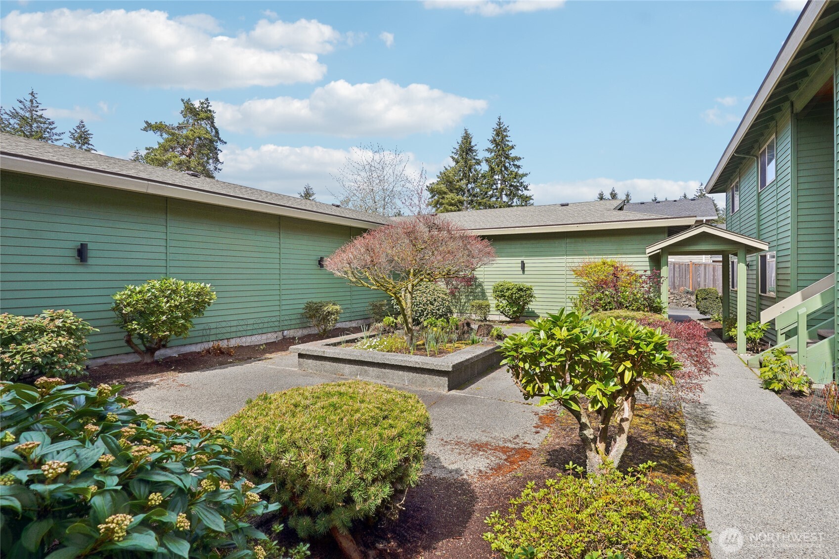 1450 Alameda Avenue, Unit 1 Fircrest, WA 98466 - Photo 17 of 19 a front view of a house with garden