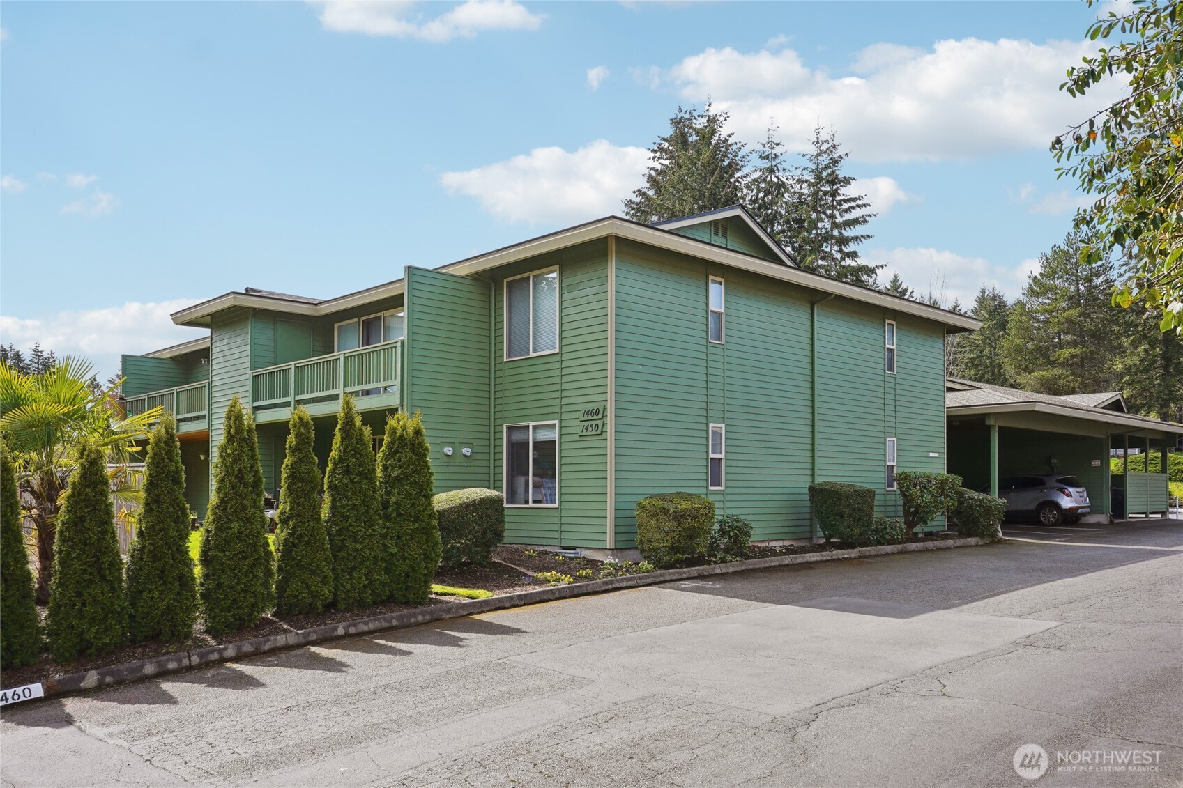 1450 Alameda Avenue, Unit 1 Fircrest, WA 98466 - Photo 18 of 19 a front view of a house with garden