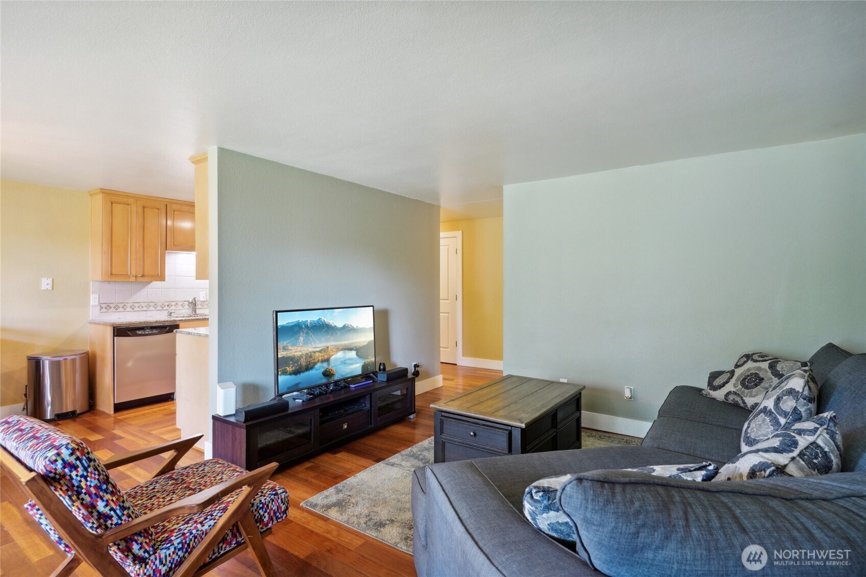 1450 Alameda Avenue, Unit 1 Fircrest, WA 98466 - Photo 4 of 19 a living room with furniture and a flat screen tv
