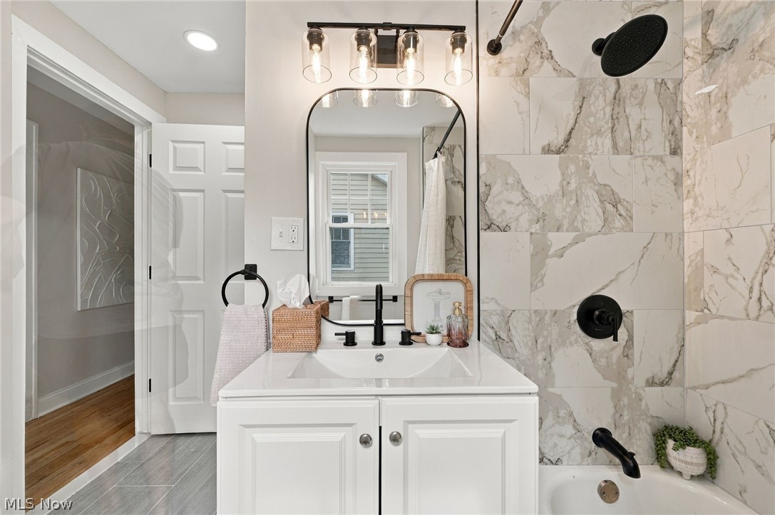 1173 Yellowstone Road Cleveland Heights, OH 44121 - Photo 29 of 44 Vanity with integrated sink, white cabinetry, and matte black fixtures