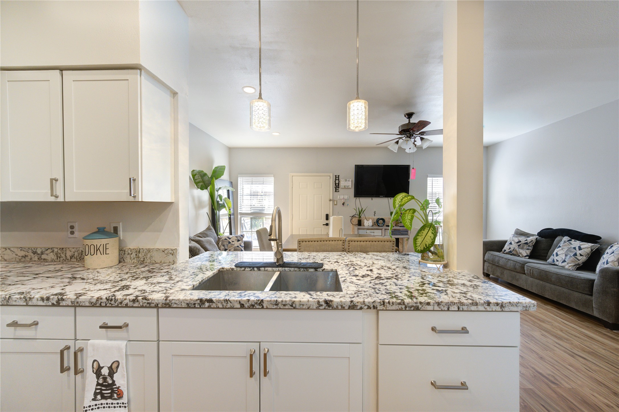 3800 Tanglewilde Street, Unit 803 Houston, TX 77063 - Photo 13 of 36 a kitchen with granite countertop a sink a stove and cabinets
