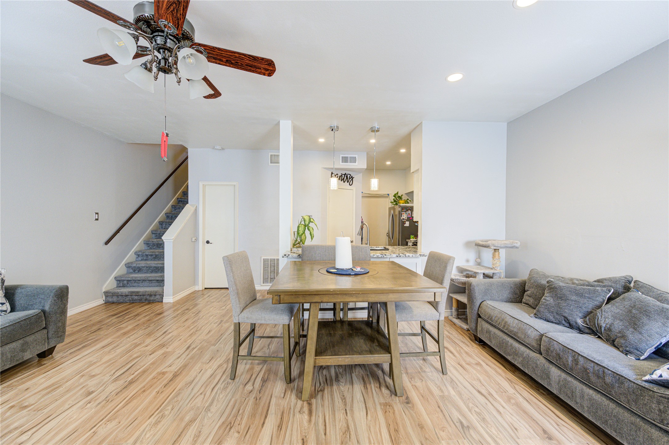 3800 Tanglewilde Street, Unit 803 Houston, TX 77063 - Photo 5 of 36 a view of a dining room with furniture and wooden floor