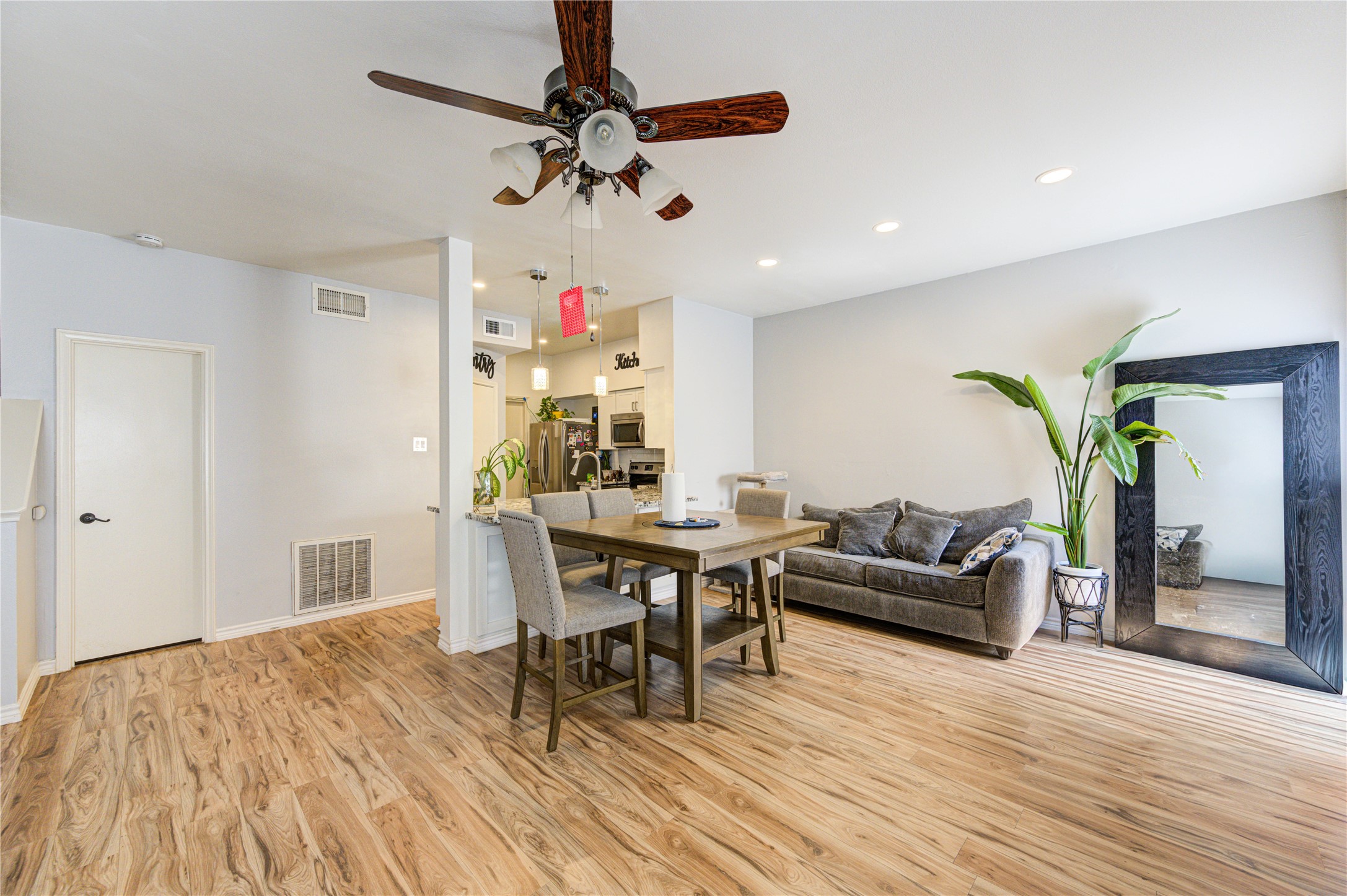 3800 Tanglewilde Street, Unit 803 Houston, TX 77063 - Photo 6 of 36 a living room with furniture and a wooden floor
