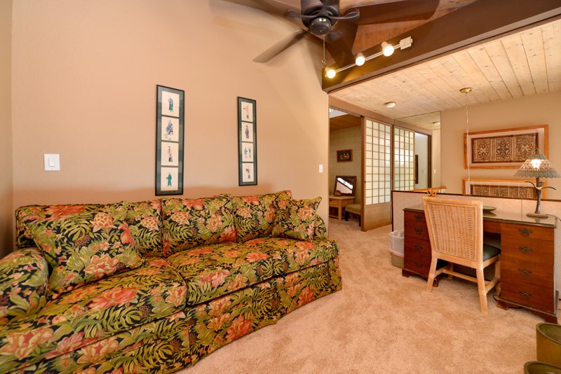 3741 Lower Honoapiilani Road, Unit 301 Lahaina, HI 96761 - Photo 14 of 18 a living room with furniture and a flat screen tv