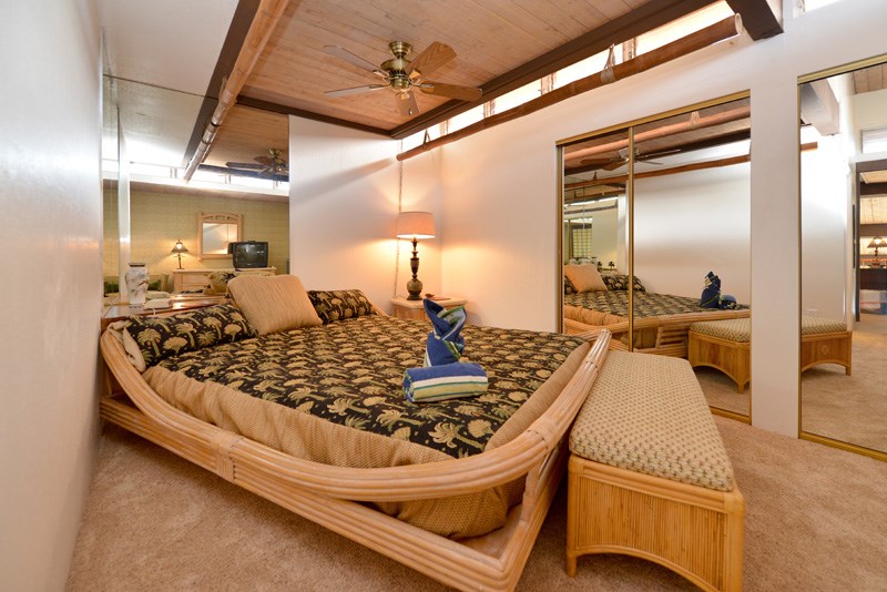 3741 Lower Honoapiilani Road, Unit 301 Lahaina, HI 96761 - Photo 15 of 18 a large bed sitting in a kitchen next to a window