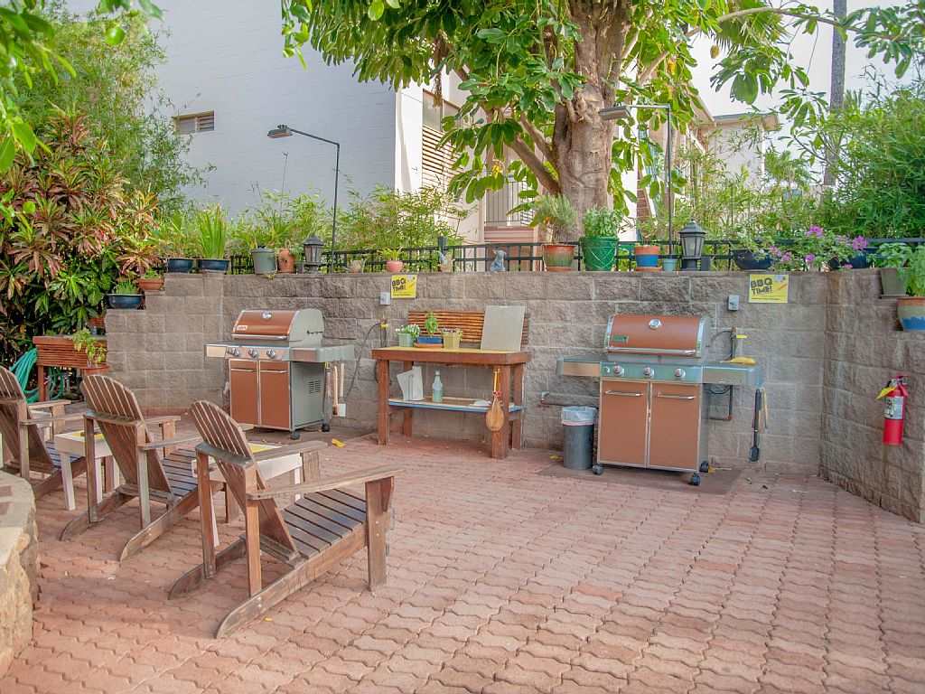 3741 Lower Honoapiilani Road, Unit 301 Lahaina, HI 96761 - Photo 16 of 18 a view of backyard with outdoor seating and plants