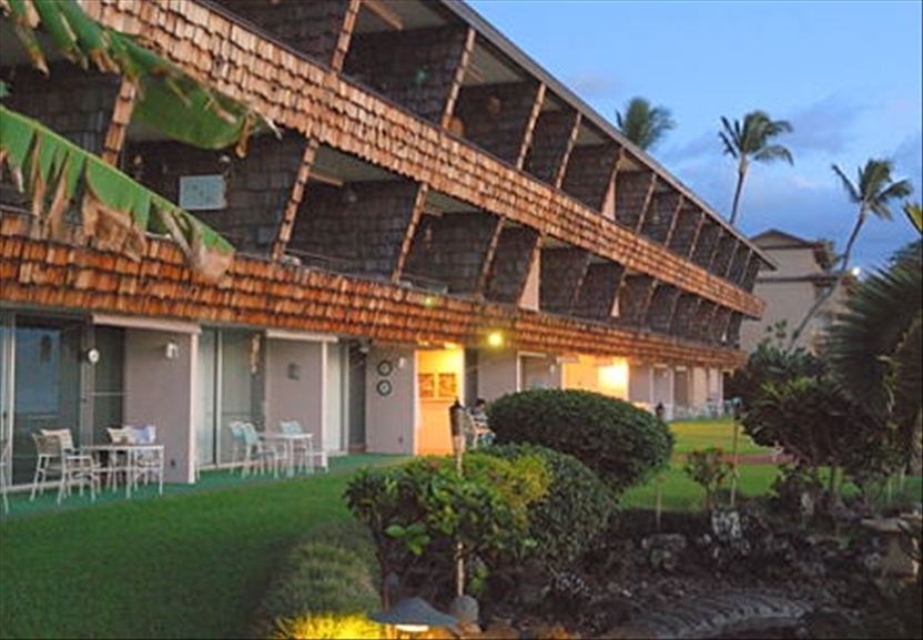 3741 Lower Honoapiilani Road, Unit 301 Lahaina, HI 96761 - Photo 17 of 18 a front view of a house with a yard