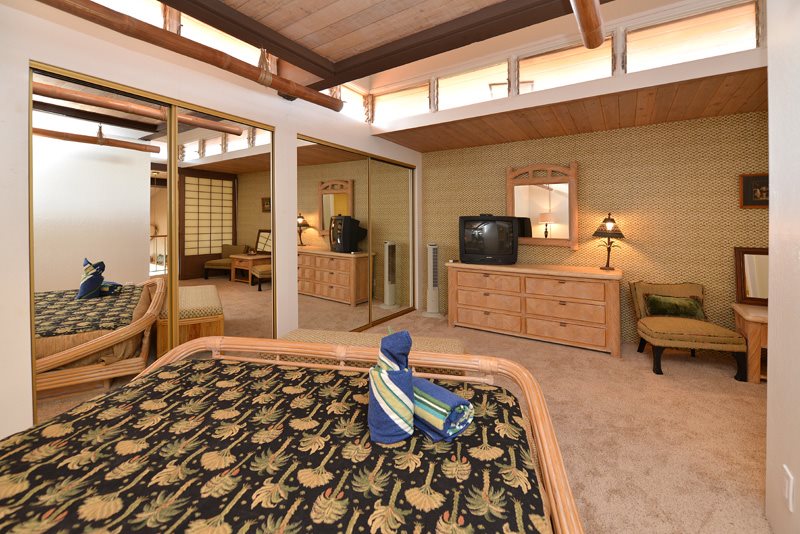 3741 Lower Honoapiilani Road, Unit 301 Lahaina, HI 96761 - Photo 4 of 18 a bedroom with a bed and a view of living room