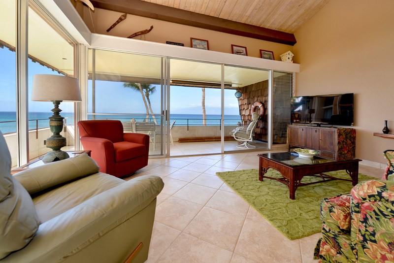 3741 Lower Honoapiilani Road, Unit 301 Lahaina, HI 96761 - Photo 10 of 18 a outdoor living space with furniture a rug and a flat screen tv