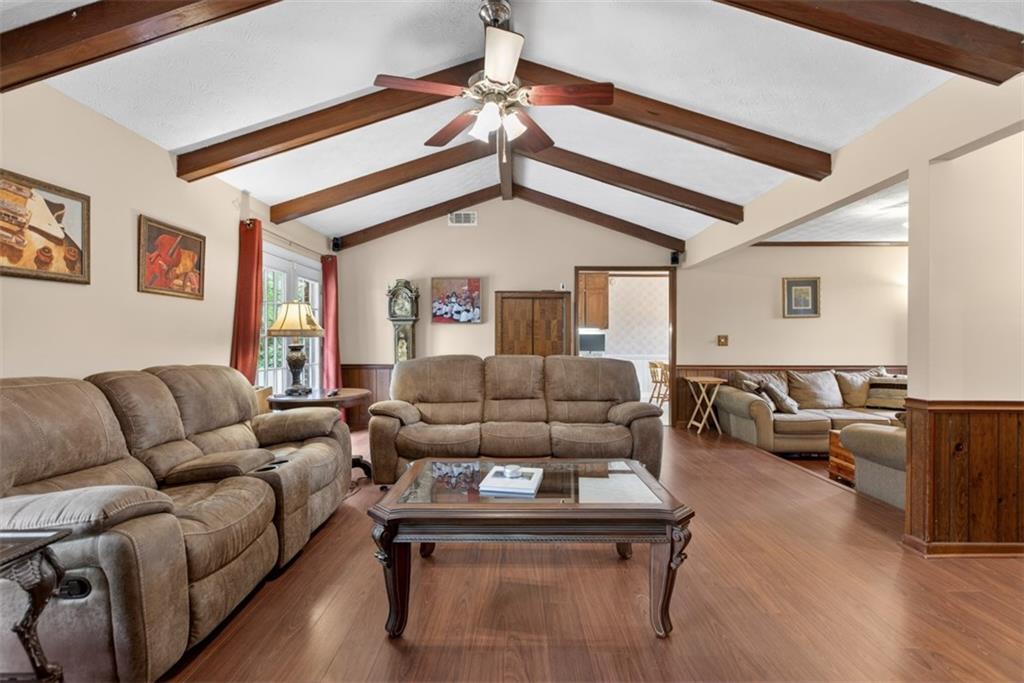 1177 Charlie Lane Southwest Lilburn, GA 30047 - Photo 15 of 49 a living room with furniture and a ceiling fan