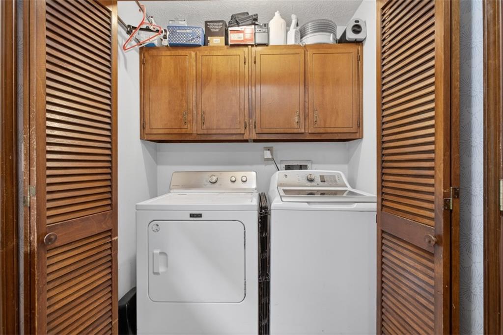 1177 Charlie Lane Southwest Lilburn, GA 30047 - Photo 25 of 49 a utility room with dryer and washer
