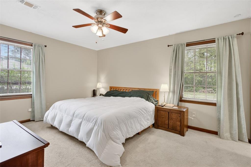 1177 Charlie Lane Southwest Lilburn, GA 30047 - Photo 35 of 49 a bedroom with a bed and a window