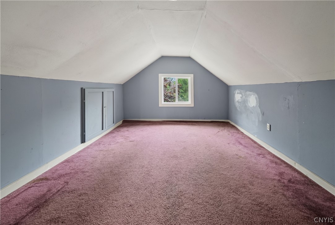 5506 Bear Road Clay, NY 13212 - Photo 24 of 36 This light and bright bedroom has a closet and wal