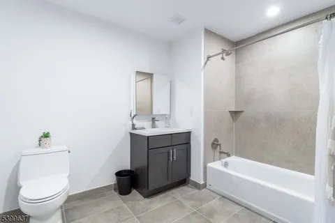 a bathroom with a sink a toilet and a bathtub