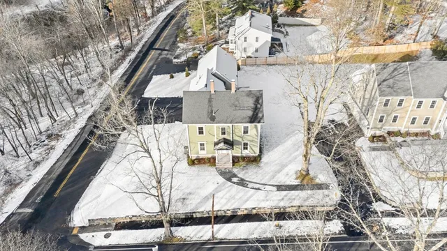 a view of a house with snow on the wall