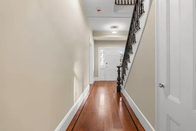 a view of entryway with wooden floor