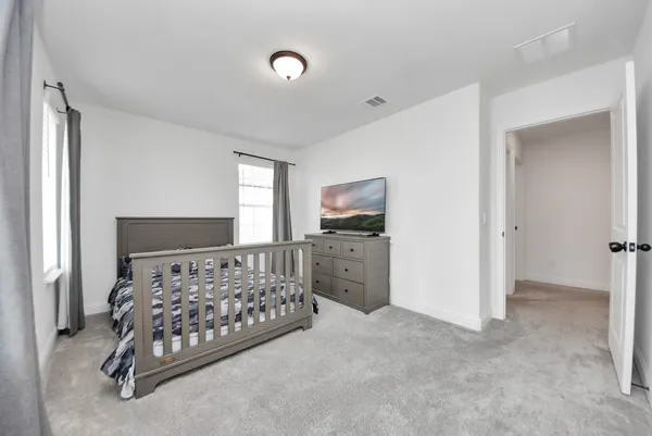 a bedroom with a bed and a cabinets