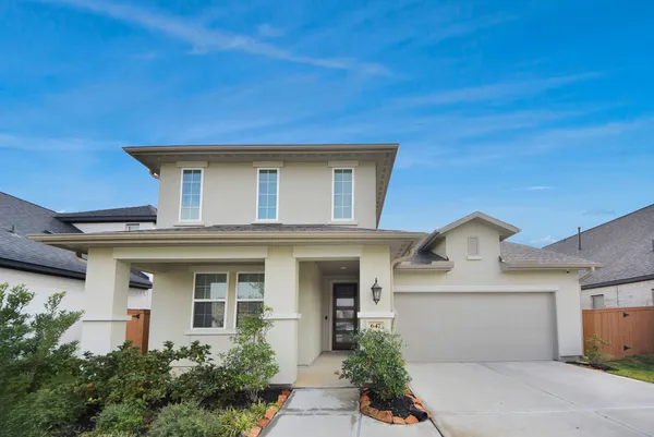 a front view of a house with a garage