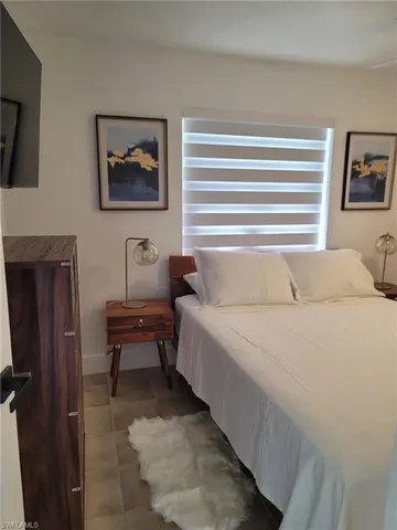 a bedroom with a bed and furniture