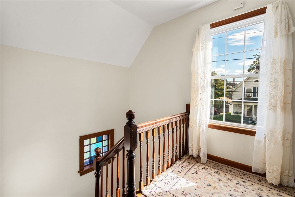 106 Norfolk Avenue Swampscott, MA 01907 - Photo 14 of 26 a view of a hallway with a window and stairs