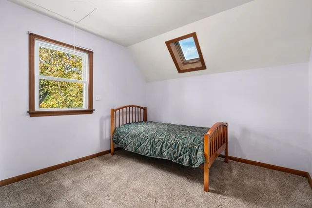 a room with a bed and a window