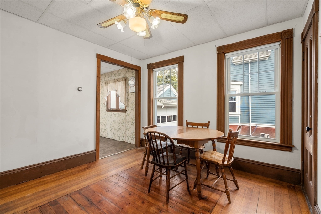 106 Norfolk Avenue Swampscott, MA 01907 - Photo 10 of 26 a view of a dining room with furniture window and wooden floor