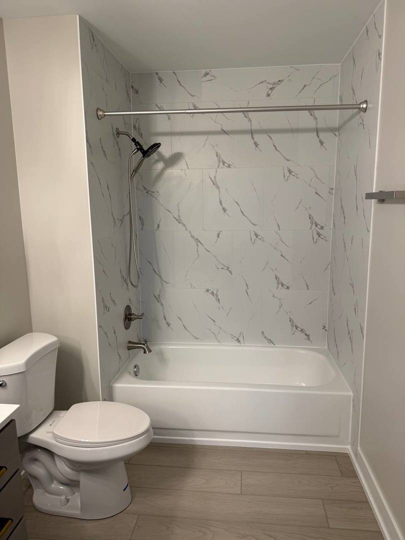 2403 Mallow Court, Unit Z1 Schaumburg, IL 60107 - Photo 11 of 17 a bathroom with a toilet and a shower