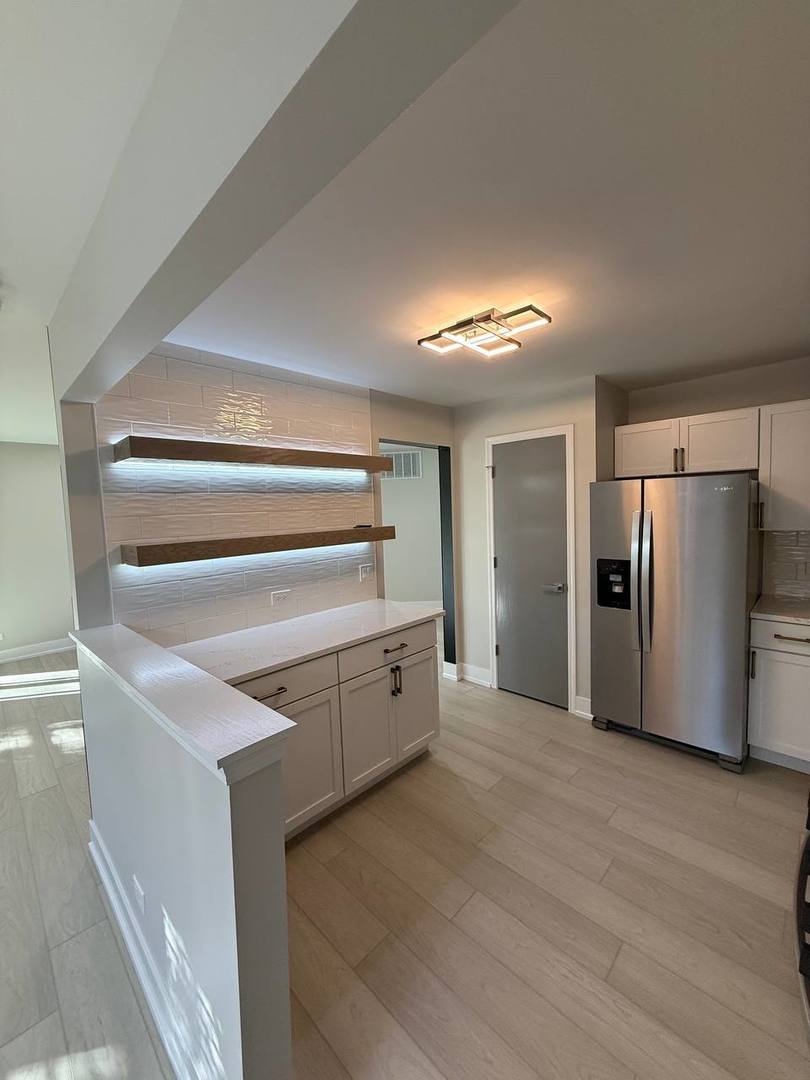 2403 Mallow Court, Unit Z1 Schaumburg, IL 60107 - Photo 3 of 17 a view of an empty room with a fireplace