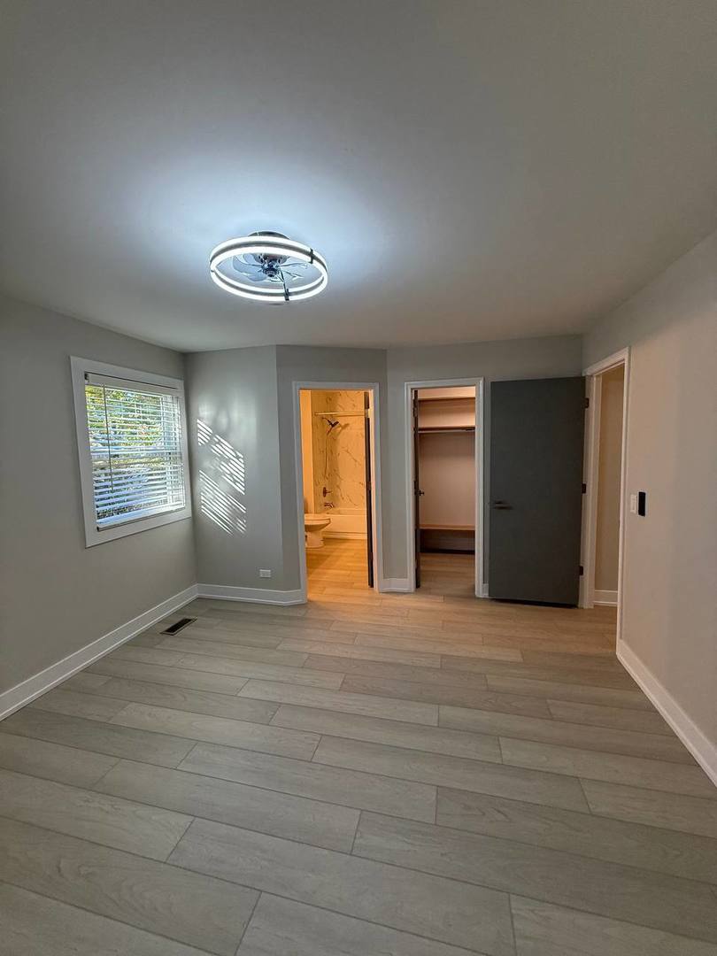 2403 Mallow Court, Unit Z1 Schaumburg, IL 60107 - Photo 9 of 17 a view of an empty room with a window