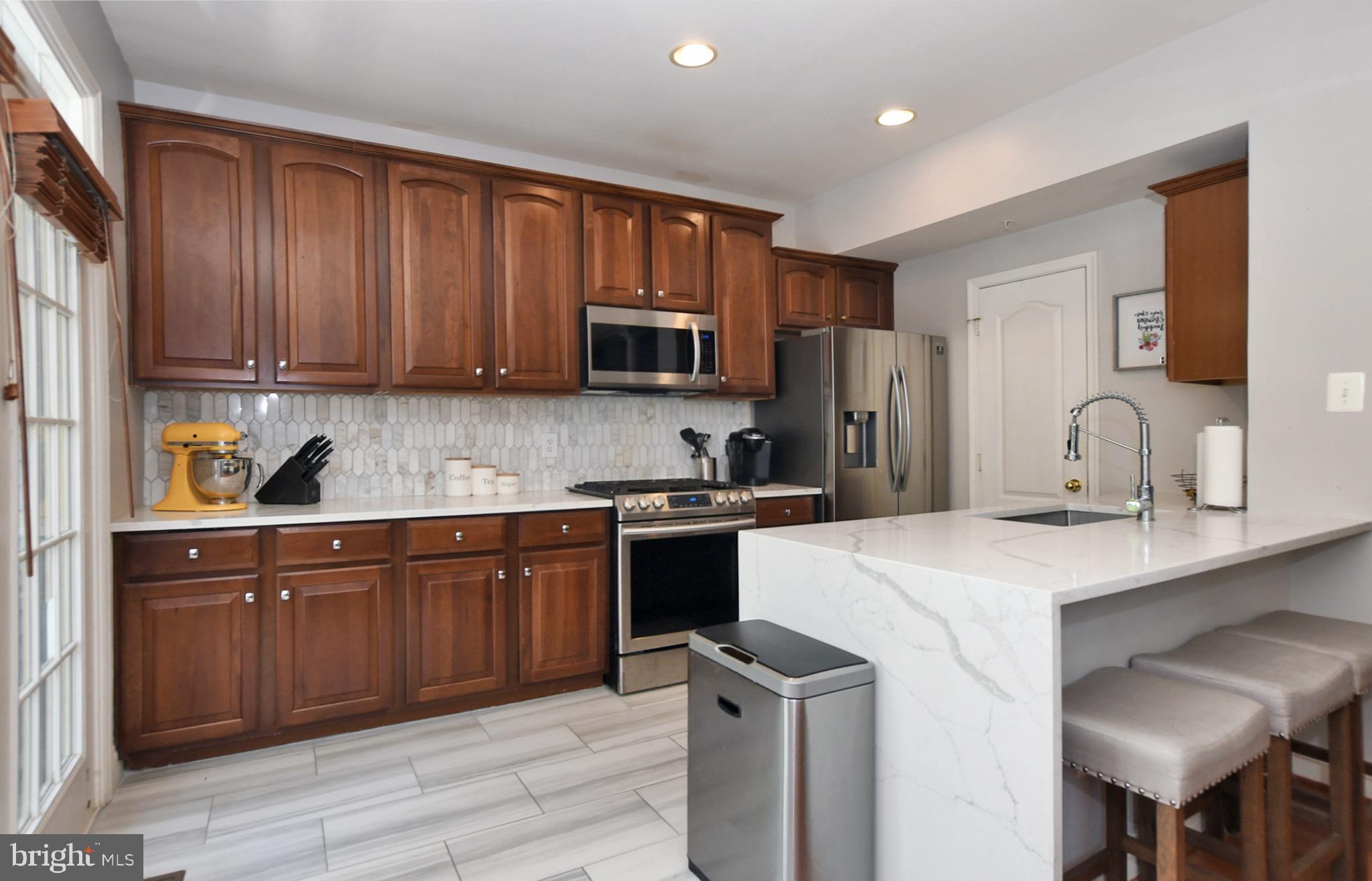 2107 Clark Place Silver Spring, MD 20910 - Photo 12 of 33 Stainless appliances and ceramic floors