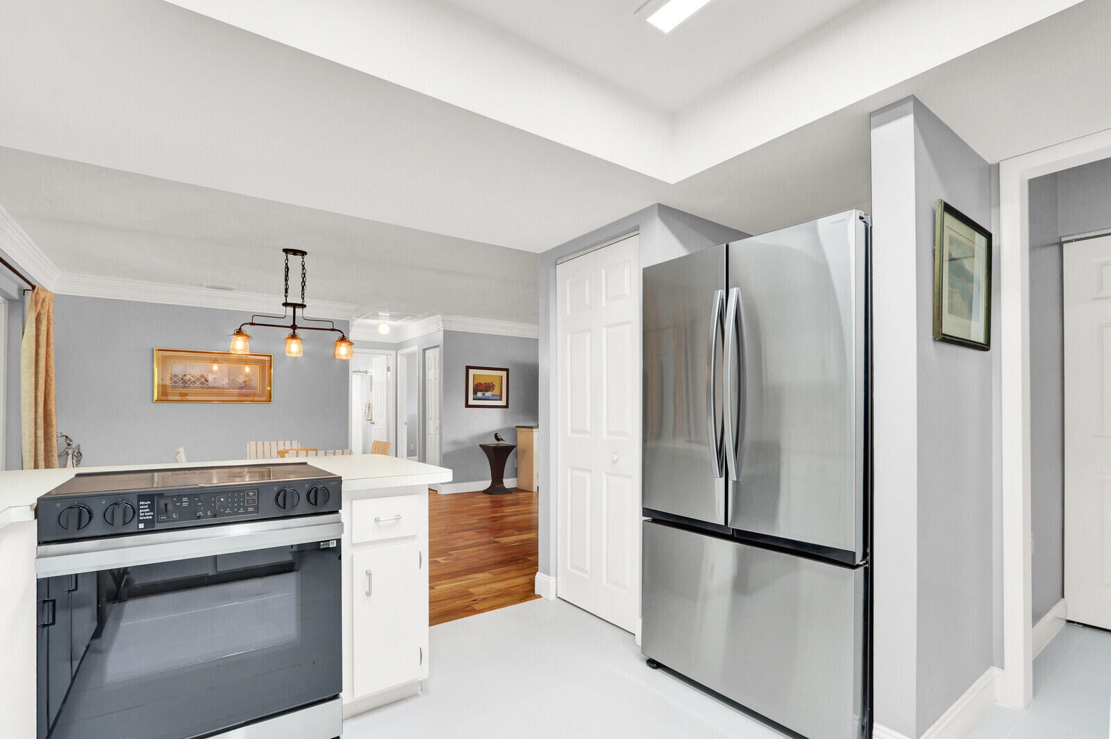 3035 Southeast Glasgow Drive Stuart, FL 34997 - Photo 17 of 52 a kitchen with stainless steel appliances a refrigerator stove and microwave