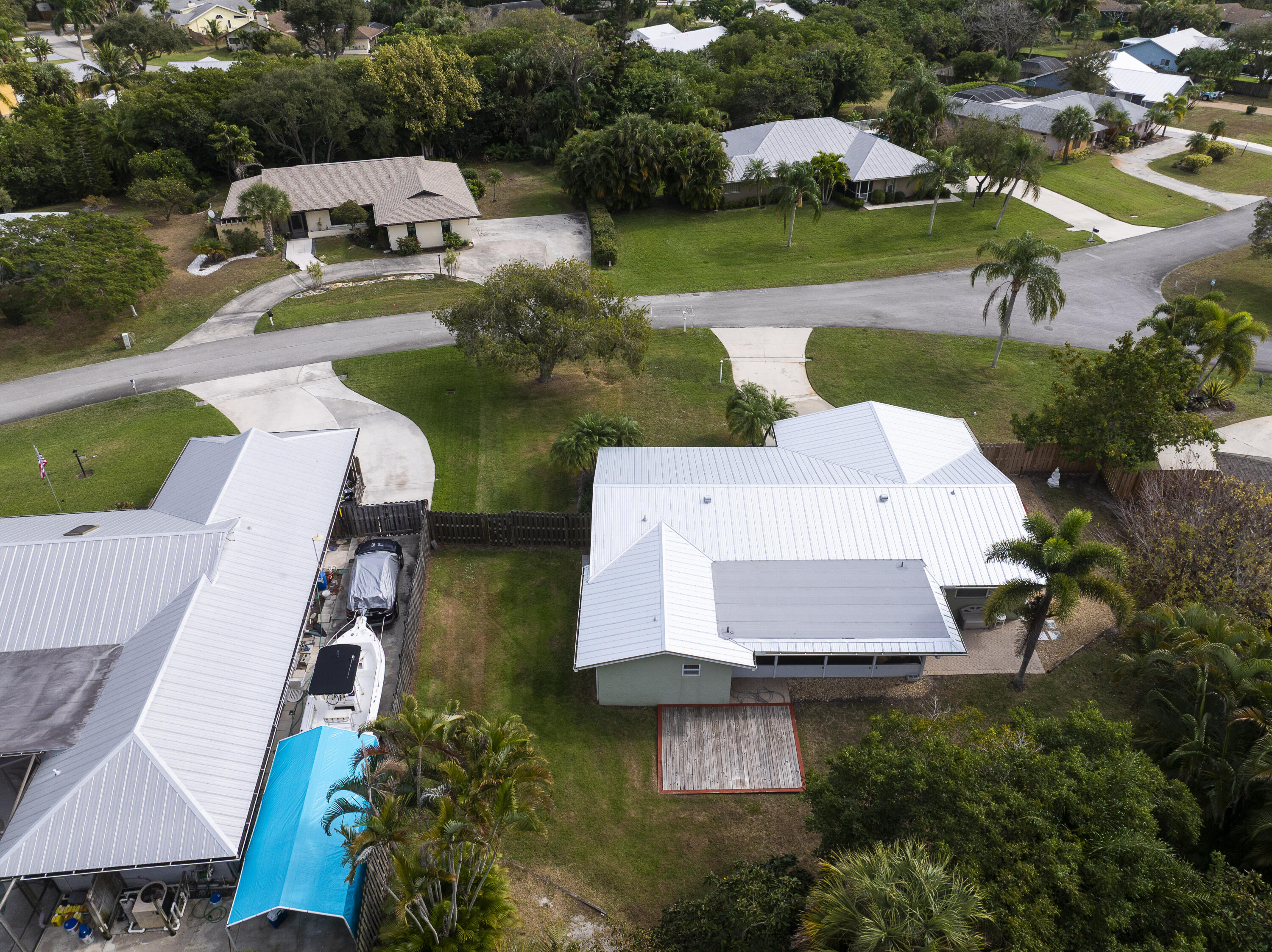 3035 Southeast Glasgow Drive Stuart, FL 34997 - Photo 46 of 52 an aerial view of a house with outdoor space pool patio and lake view