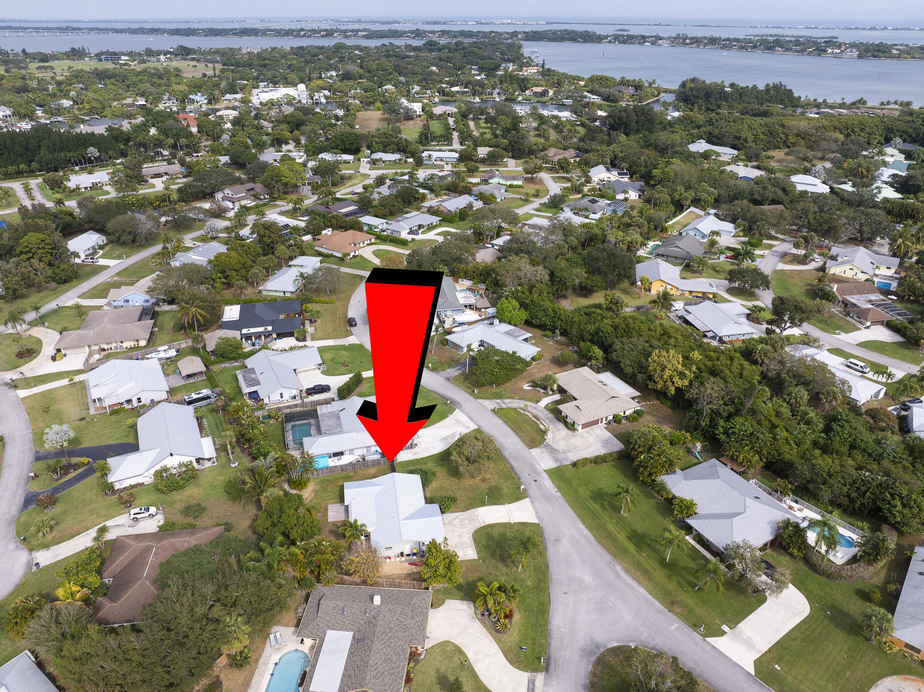 3035 Southeast Glasgow Drive Stuart, FL 34997 - Photo 49 of 52 an aerial view of residential houses with outdoor space